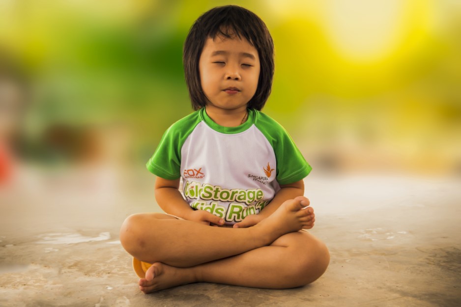 A young child meditating