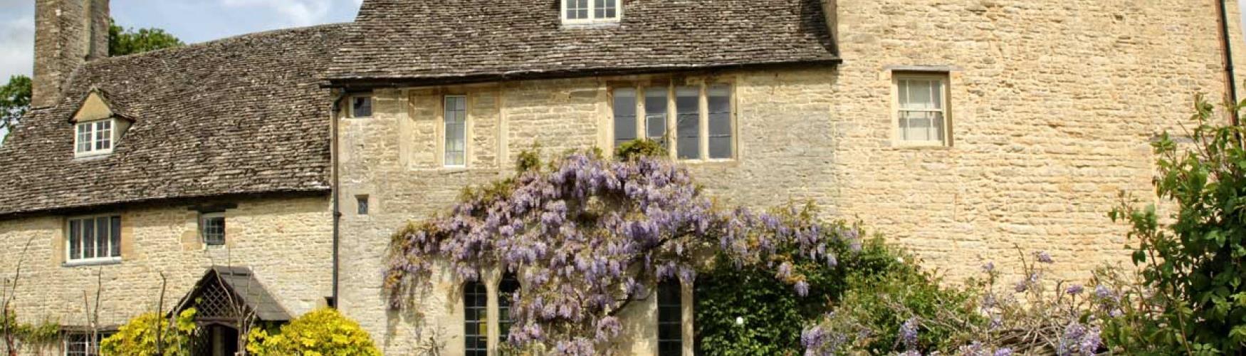 Wisteria covering the manor house at Cogges Manor Farm