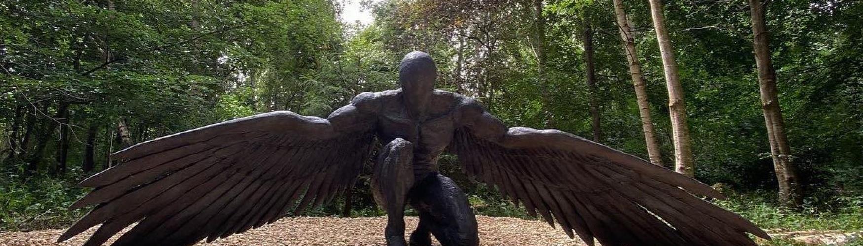 Crouching angel sculpture at Cotswold Sculpture Park